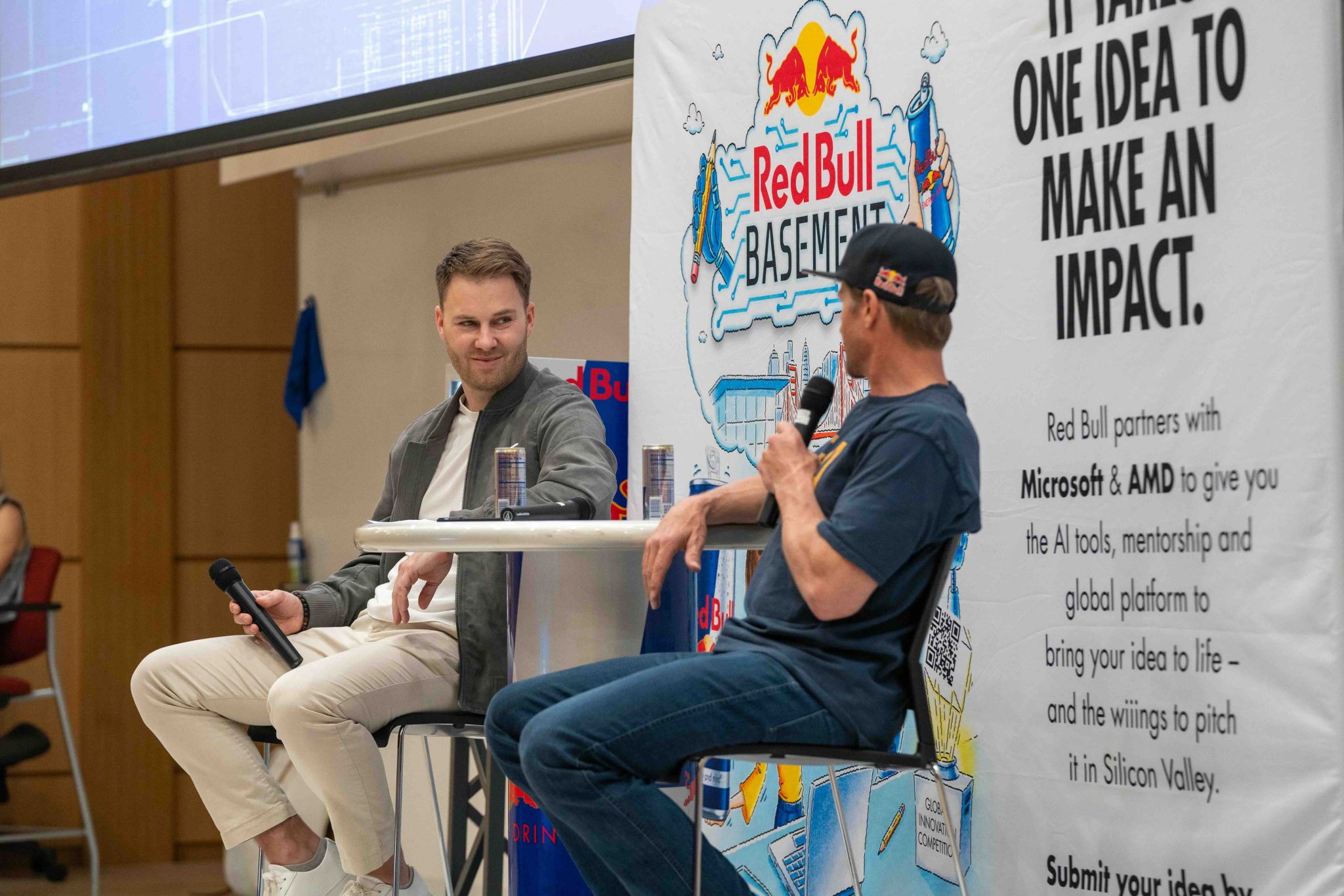 Michael Rueckert moderating the panel with Red Bull athlete Daron Rahlves at the University of Utah.